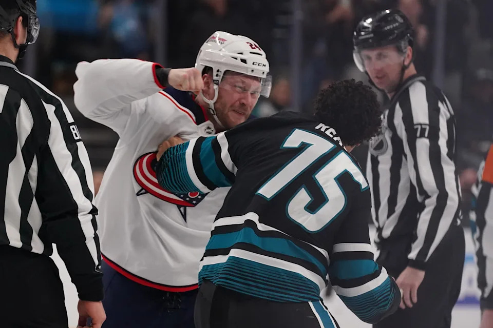 Jan 6, 2026; San Jose, California, USA; Columbus Blue Jackets right winger Mathieu Olivier (24) and San Jose Sharks right wing Ryan Reaves (75) fight in the second period at SAP Center at San Jose. Mandatory Credit: David Gonzales-Imagn Images