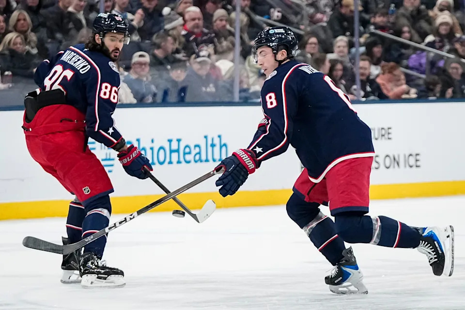Columbus Blue Jackets defenseman Zach Werenski (8) skates by right wing Kirill Marchenko (86) during the first period of the NHL hockey game against the Ottawa Senators at Nationwide Arena in Columbus on Jan. 20, 2026.