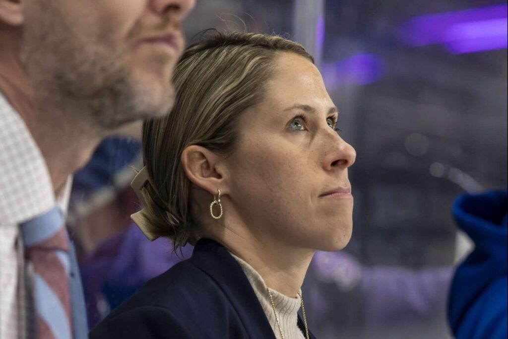 Kim Weiss looks on from the Colorado Eagles bench.