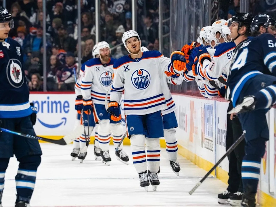 Jack Roslovic #28 of the Edmonton Oilers celebrates his goal with teammates in the second period against the Winnipeg Jets at Canada Life Centre on Dec. 29, 2025 in Winnipeg.