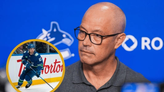 Vancouver Canucks forward Max Sasson and general manager Patrik Allvin.