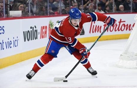 Nov 13, 2025; Montreal, Quebec, CAN; Montreal Canadiens right wing Cole Caufield (13) plays the puck against the Dallas Stars during the second period at Bell Centre. Mandatory Credit: David Kirouac-Imagn Images