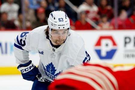Dec 28, 2025; Detroit, Michigan, USA; Toronto Maple Leafs left wing Matias MacCelli (63) gets set during a face off in the first period against the Detroit Red Wings at Little Caesars Arena. Mandatory Credit: Rick Osentoski-Imagn Images