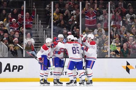 Dec 23, 2025; Boston, Massachusetts, USA; Montreal Canadians forward Sammy Blais (27) celebrates his goal with his teammates during the first period against the Boston Bruins at TD Garden. Mandatory Credit: Bob DeChiara-Imagn Images
