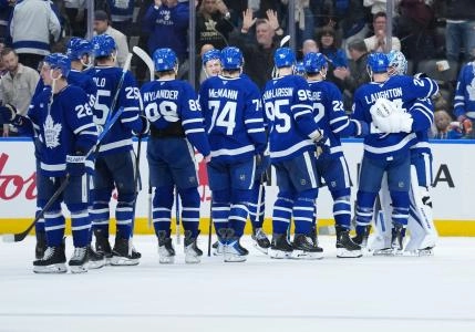 Jan 10, 2026; Toronto, Ontario, CAN; Toronto Maple Leafs goaltender Joseph Woll (60) celebrates the win with center Scott Laughton (24) against the Vancouver Canucks at the end of the third period at Scotiabank Arena