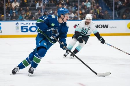 Jan 2, 2026; Vancouver, British Columbia, CAN; Vancouver Canucks defenseman Zeev Buium (24) handles the puck against the Seattle Kraken in the third period at Rogers Arena.