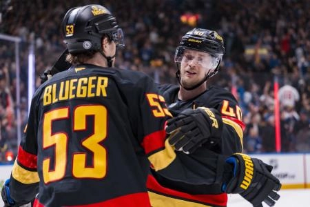 Mar 7, 2025; Vancouver, British Columbia, CAN; Vancouver Canucks forward Teddy Blueger (53) and forward Elias Pettersson (40) celebrate Blueger's goal against the Minnesota Wild in the third period at Rogers Arena.
