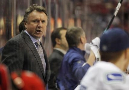 January 14, 2011; Washington, DC, USA; Vancouver Canucks asistant coach Rick Bowness talks on the bench during the Canucks game against the Washington Capitals at Verizon Center.