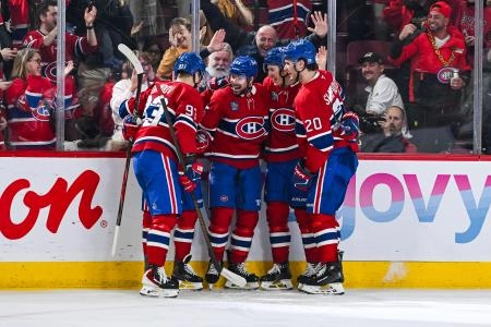Jan 12, 2026; Montreal, Quebec, CAN; Montreal Canadiens defenseman Alexandre Carrier (45) celebrates with his teammates his second goal of the game against the Vancouver Canucks during the second period at Bell Centre. Mandatory Credit: David Kirouac-Imagn Images