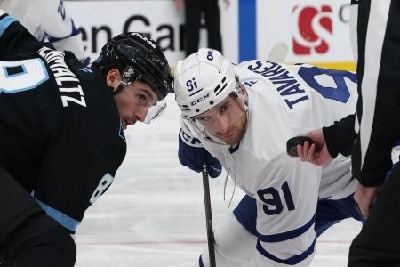 Jan 13, 2026; Salt Lake City, Utah, USA; Utah Mammoth center Nick Schmaltz (8) and Toronto Maple Leafs center John Tavares (91) wait for a faceoff during the third period at Delta Center. Mandatory Credit: Rob Gray-Imagn Images