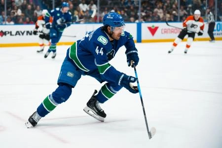 Dec 30, 2025; Vancouver, British Columbia, CAN; Vancouver Canucks forward Kiefer Sherwood (44) skates against the Philadelphia Flyers in the first period at Rogers Arena.