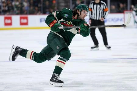 Jan 15, 2026; Saint Paul, Minnesota, USA; Minnesota Wild defenseman Quinn Hughes (43) shoots the puck against the Winnipeg Jets during the third period at Grand Casino Arena.