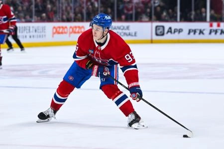 Jan 12, 2026; Montreal, Quebec, CAN; Montreal Canadiens right wing Ivan Demidov (93) plays the puck against the Vancouver Canucks during the second period at Bell Centre. Mandatory Credit: David Kirouac-Imagn Images
