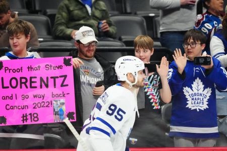 Jan 12, 2026; Denver, Colorado, USA; Toronto Maple fans cheer towards defenseman Oliver Ekman-Larsson (95) before the game against the Colorado Avalanche at Ball Arena. Mandatory Credit: Ron Chenoy-Imagn Images