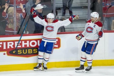 Jan 17, 2026; Ottawa, Ontario, CAN; Montreal Canadiens right wing Cole Caufield (13) celebrates with teammates after scoring the game winning overtime goal against the Ottawa Senators at the Canadian Tire Centre. Mandatory Credit: Marc DesRosiers-IMAGN Images