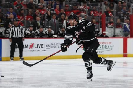 Dec 21, 2025; Newark, New Jersey, USA; New Jersey Devils defenseman Dougie Hamilton (7) takes a shot against the Buffalo Sabres during the second period at Prudential Center. Mandatory Credit: Thomas Salus-Imagn Images