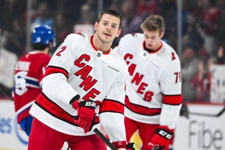 Apr 16, 2025; Montreal, Quebec, CAN; Carolina Hurricanes center Jesperi Kotkaniemi (82) looks on in warm-up before the game against the Montreal Canadiens at Bell Centre. Mandatory Credit: David Kirouac-Imagn Images