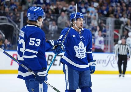 Jan 10, 2026; Toronto, Ontario, CAN; Toronto Maple Leafs left wing Nicholas Robertson (89) scores a goal and celebrates with right wing Easton Cowan (53) against the Vancouver Canucks during the third period at Scotiabank Arena. Mandatory Credit: Nick Turchiaro-Imagn Images