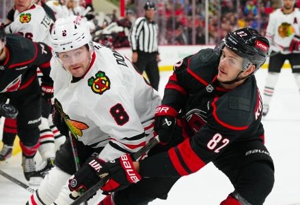 Jan 30, 2025; Raleigh, North Carolina, USA; Carolina Hurricanes center Jesperi Kotkaniemi (82) and Chicago Blackhawks center Ryan Donato (8) watch the play during the second period at Lenovo Center.