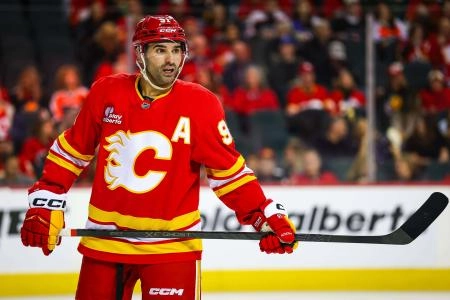 Dec 31, 2025; Calgary, Alberta, CAN; Calgary Flames center Nazem Kadri (91) against the Philadelphia Flyers during the second period at Scotiabank Saddledome. Mandatory Credit: Sergei Belski-Imagn Images