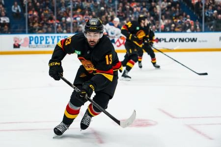 Jan 17, 2026; Vancouver, British Columbia, CAN; Vancouver Canucks forward Arshdeep Bains (13) skates against the Edmonton Oilers in the first period at Rogers Arena.