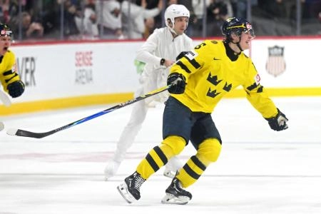Jan 5, 2026; St. Paul, Minnesota, USA; Sweden forward Ivar Stenberg (15) celebrates his empty-net goal against Czechia during the third period in the final of the 2026 IIHF World Junior Championship ice hockey tournament at Grand Casino Arena.