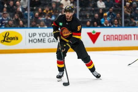 Jan 19, 2026; Vancouver, British Columbia, CAN; Vancouver Canucks forward Evander Kane (91) skates against the New York Islanders in the third period at Rogers Arena.