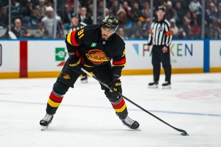 Jan 21, 2026; Vancouver, British Columbia, CAN; Vancouver Canucks forward Evander Kane (91) shoots against the Washington Capitals in the second period at Rogers Arena.