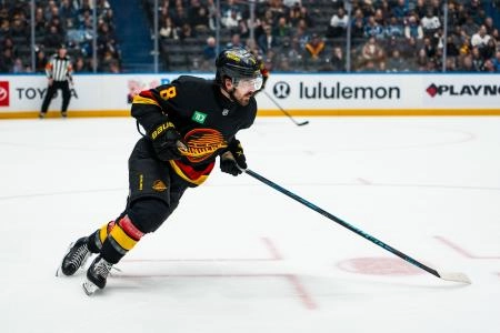 Jan 19, 2026; Vancouver, British Columbia, CAN; Vancouver Canucks forward Conor Garland (8) skates against the New York Islanders in the third period at Rogers Arena.