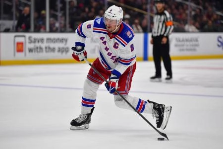 Jan 20, 2026; Los Angeles, California, USA; New York Rangers center J.T. Miller (8) shoots on goal against the Los Angeles Kings during the third period at Crypto.com Arena.