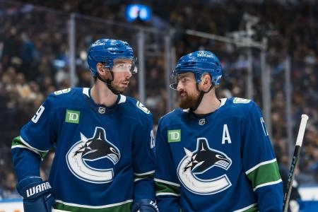 Jan 25, 2026; Vancouver, British Columbia, CAN; Vancouver Canucks defenseman Marcus Pettersson (29) talks with defenseman Filip Hronek (17) during a stop in play against the Pittsburgh Penguins in the first period at Rogers Arena.