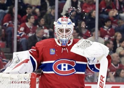 Jan 7, 2026; Montreal, Quebec, CAN; Montreal Canadiens goalie Jacob Fowler (32) takes a breather during the first period of the game against the Calgary Flames at the Bell Centre. Mandatory Credit: Eric Bolte-Imagn Images