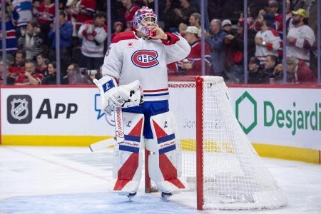 Jan 17, 2026; Ottawa, Ontario, CAN; Montreal Canadiens goalie Samuel Montembeault (35) adjusts his mask during a break in the first period against the Ottawa Senators at the Canadian Tire Centre.