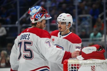 Oct 28, 2025; Seattle, Washington, USA; Montreal Canadiens goaltender Jakub Dobes (75) and Montreal Canadiens defenseman Arber Xhekaj (72) talk during the third period against the Seattle Kraken at Climate Pledge Arena. Mandatory Credit: Steven Bisig-Imagn Images