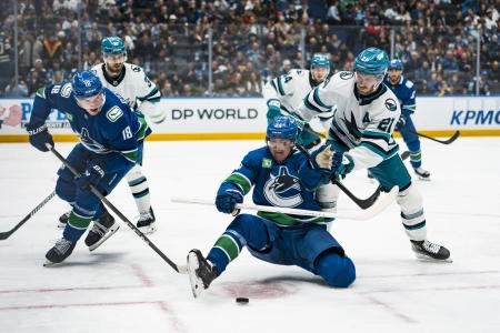 Jan 27, 2026; Vancouver, British Columbia, CAN; Vancouver Canucks forward Drew O'Connor (18) watches forward Aatu Raty (54) battle with San Jose Sharks forward Alexander Wennberg (21) in the second period at Rogers Arena.