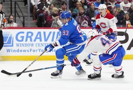 Nov 29, 2025; Denver, Colorado, USA; Montreal Canadiens defenseman Alexandre Carrier (45) defends on Colorado Avalanche center Zakhar Bardakov (93) in the second period at Ball Arena.