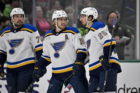 Dec 14, 2024; Dallas, Texas, USA; St. Louis Blues defenseman Justin Faulk (72) and center Robert Thomas (18) and center Jordan Kyrou (25) in action during the game between the Dallas Stars and the St. Louis Blues at American Airlines Center.