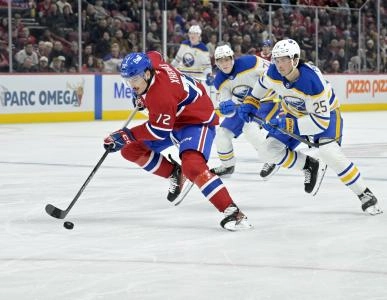 Mar 3, 2025; Montreal, Quebec, CAN; Montreal Canadiens defenseman Arber Xhekaj (72) breaks away from Buffalo Sabres defenseman Owen Power (25) during the second period at the Bell Centre.