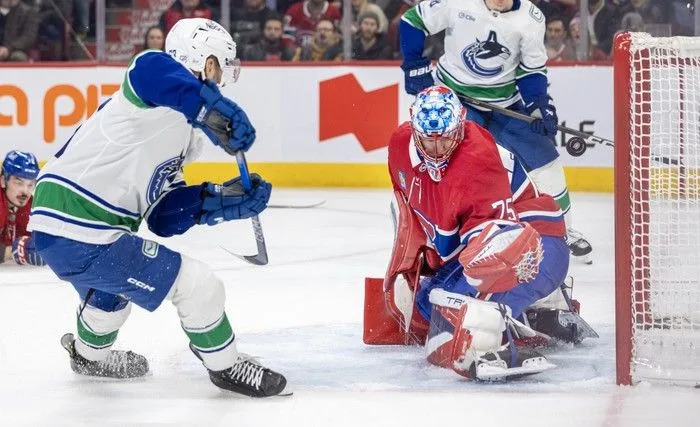  Vancouver Canucks’ Max Sasson shoots the puck past Montreal Canadiens goalie Jakub Dobes for a goal during the second period at the Bell Centre in Montreal on Monday January 12, 2026.