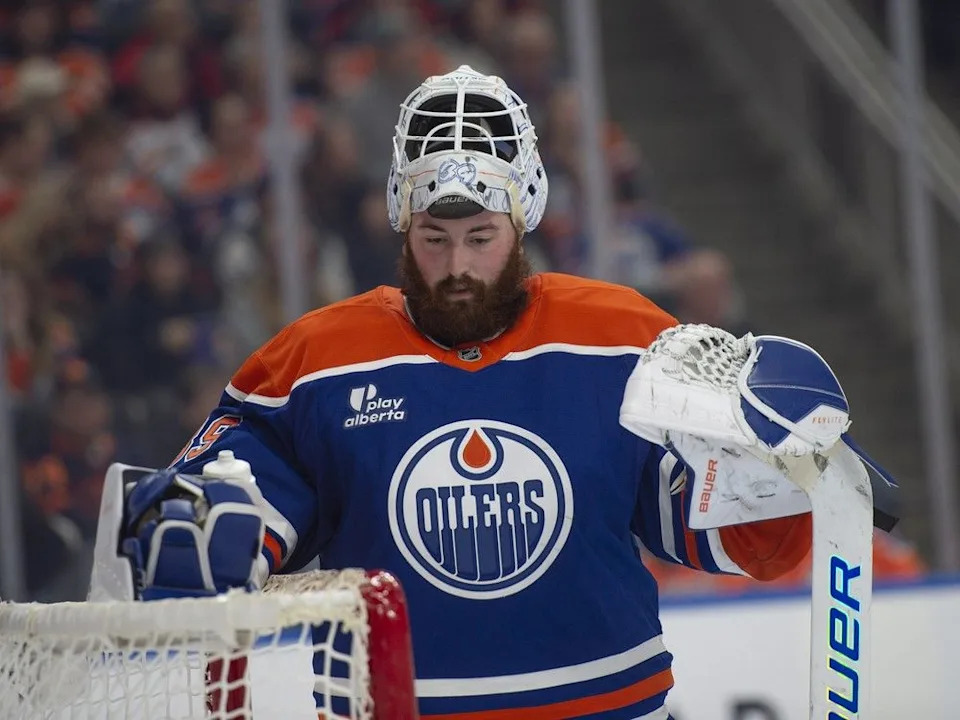  Edmonton Oilers goaltender Connor Ingram takes a breather during a stoppage of play against the Vegas Golden Knights in the second period at Rogers Place in Edmonton on Sunday, Dec. 21, 2025.