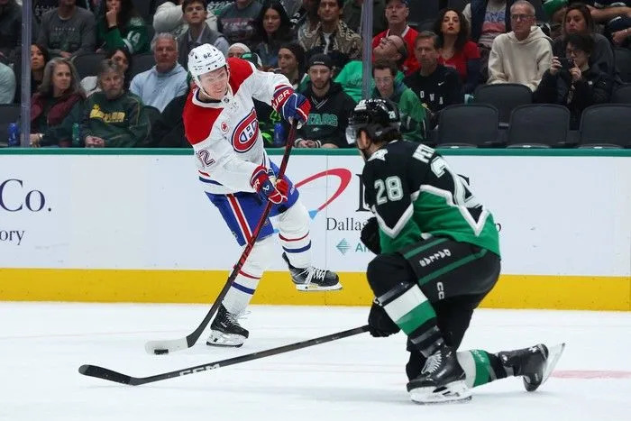  Owen Beck of the Montreal Canadiens shoots the puck past Alexander Petrovic of the Dallas Stars at American Airlines Center on Sunday, January 4, 2026 in Dallas, Texas.