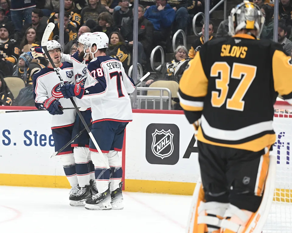 Jan 17, 2026; Pittsburgh, Pennsylvania, USA; Columbus Blue Jackets right wing Kirill Marchenko (86) celebrates a goal with center Cole Sillinger (4) and defenseman Damon Severson (78) after scoring on Pittsburgh Penguins goalie Arturs Silovs (37) during the second period at PPG Paints Arena. Mandatory Credit: Philip G. Pavely-Imagn Images
