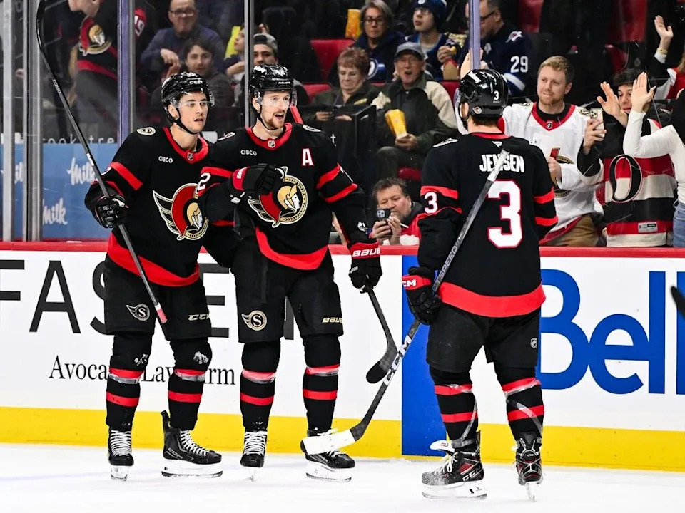  Thomas Chabot of the Senators celebrates his second goal of the game with teammates Shane Pinto, left, and Nick Jensen (3) in the second period on Saturday night.