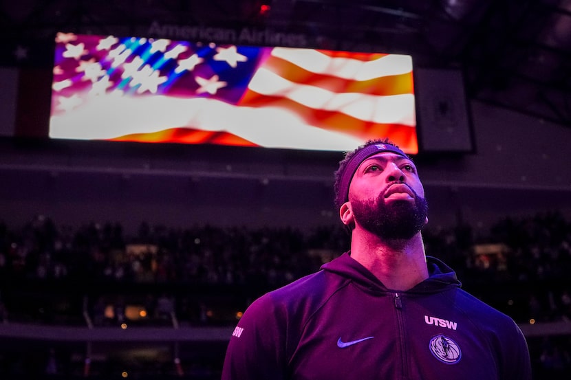 Dallas Mavericks forward Anthony Davis stands for the national anthem before an NBA...