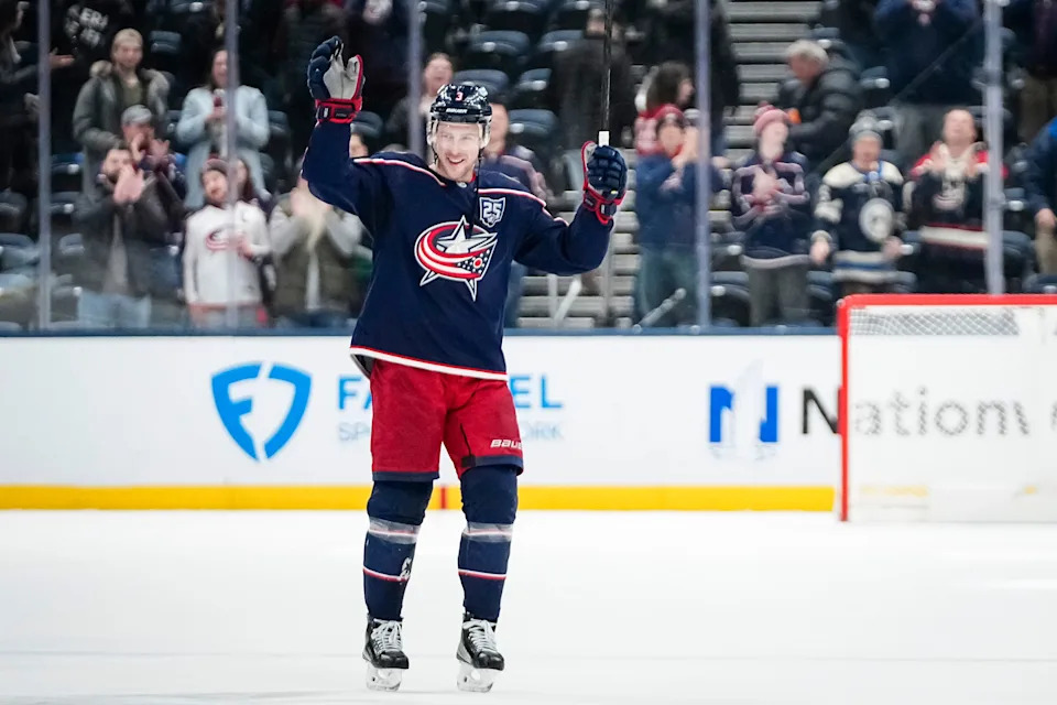 Blue Jackets center Charlie Coyle skates around the ice to absorb the applause of fans saluting his 1,000th career game – a 1-0 win over the Stars.