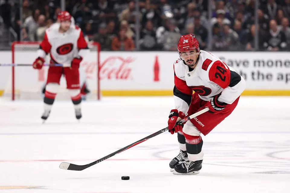 Seth Jarvis of the Carolina Hurricanes skates with the puck against the Los Angeles Kings during the third period at Crypto.com Arena on October 18, 2025 in Los Angeles, California. Jarvis went down injured Thursday against the Islanders after taking two pucks off the left foot.