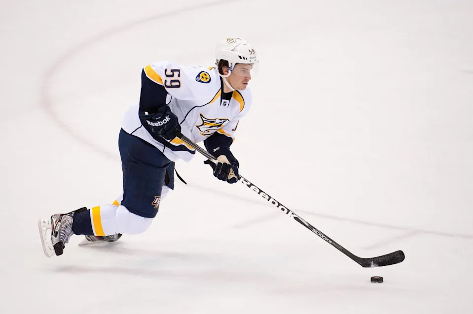 Nov 26, 2011; Detroit, MI, USA; Nashville Predators defenseman Roman Josi (59) takes the puck up ice against the Detroit Red Wings during the third period at the Joe Louis Arena. Detroit won 4-1. Mandatory Credit: Tim Fuller-Imagn Images