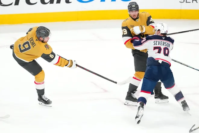 Jan 8, 2026; Las Vegas, Nevada, USA; A shot from Vegas Golden Knights center Jack Eichel (9) takes the blade off the skate of Columbus Blue Jackets defenseman Damon Severson (78) during the third period at T-Mobile Arena.
