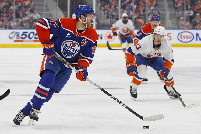 Jan 15, 2026; Edmonton, Alberta, CAN; Edmonton Oilers forward Connor McDavid (97) controls the puck against the New York Islanders during the first period at Rogers Place.