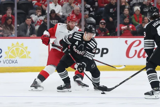 Jan 17, 2026; Newark, New Jersey, USA; New Jersey Devils left wing Jesper Bratt (63) controls the puck during his 600th game against the Carolina Hurricanes during the first period at Prudential Center.